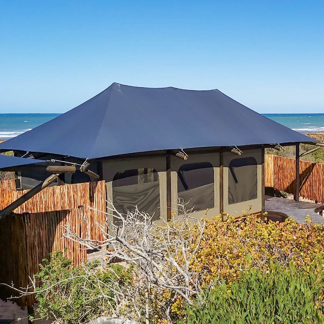 Dark stretch tent at a coastal property