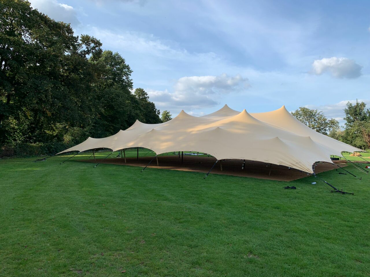 Large stretch tent creating an outdoor gathering space